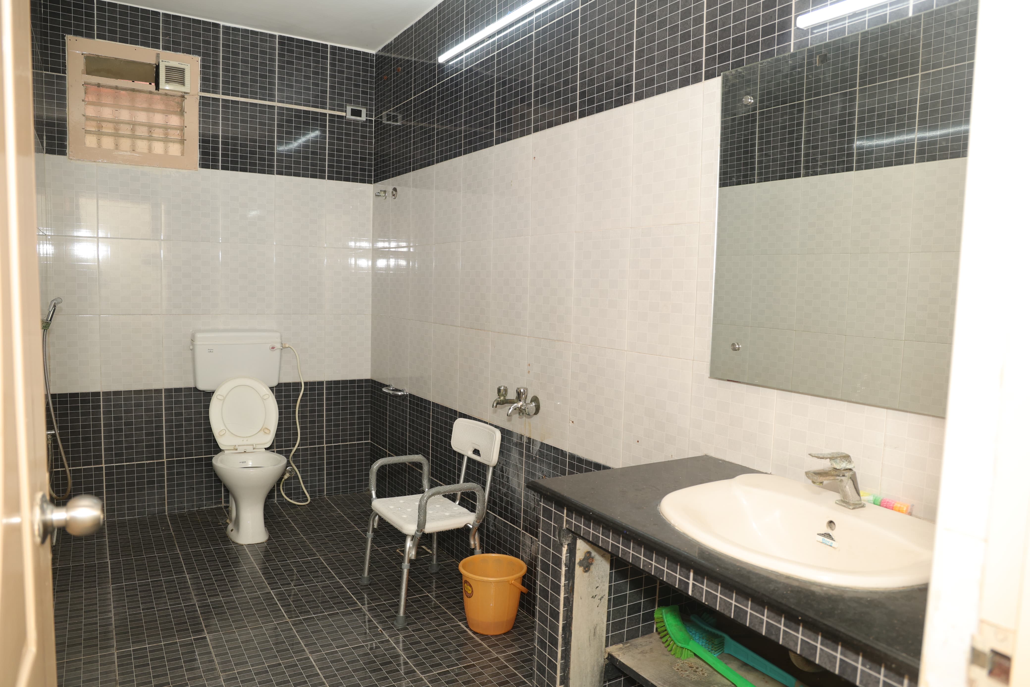 Bedroom with AC and amenities at Waves Home Old Age Home Chennai